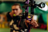 Metal Arrow of Crossbow in Man's Hands