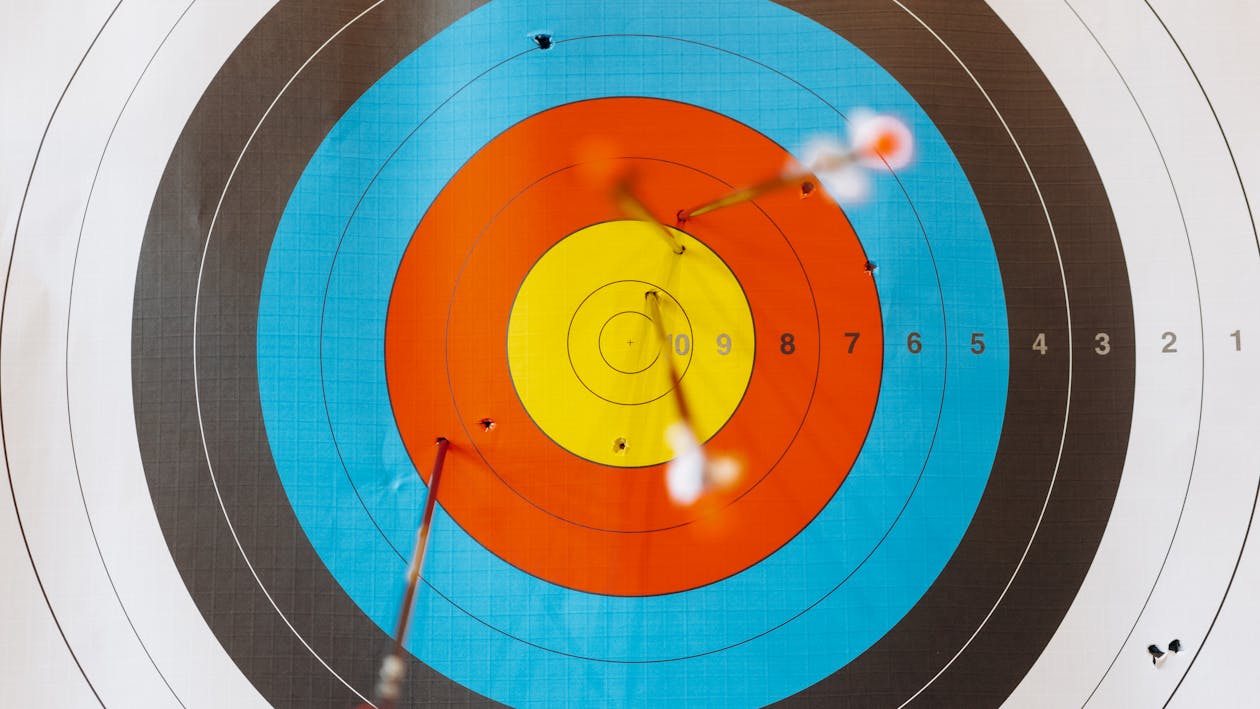 Free Arrows Pierced on a Target Stock Photo