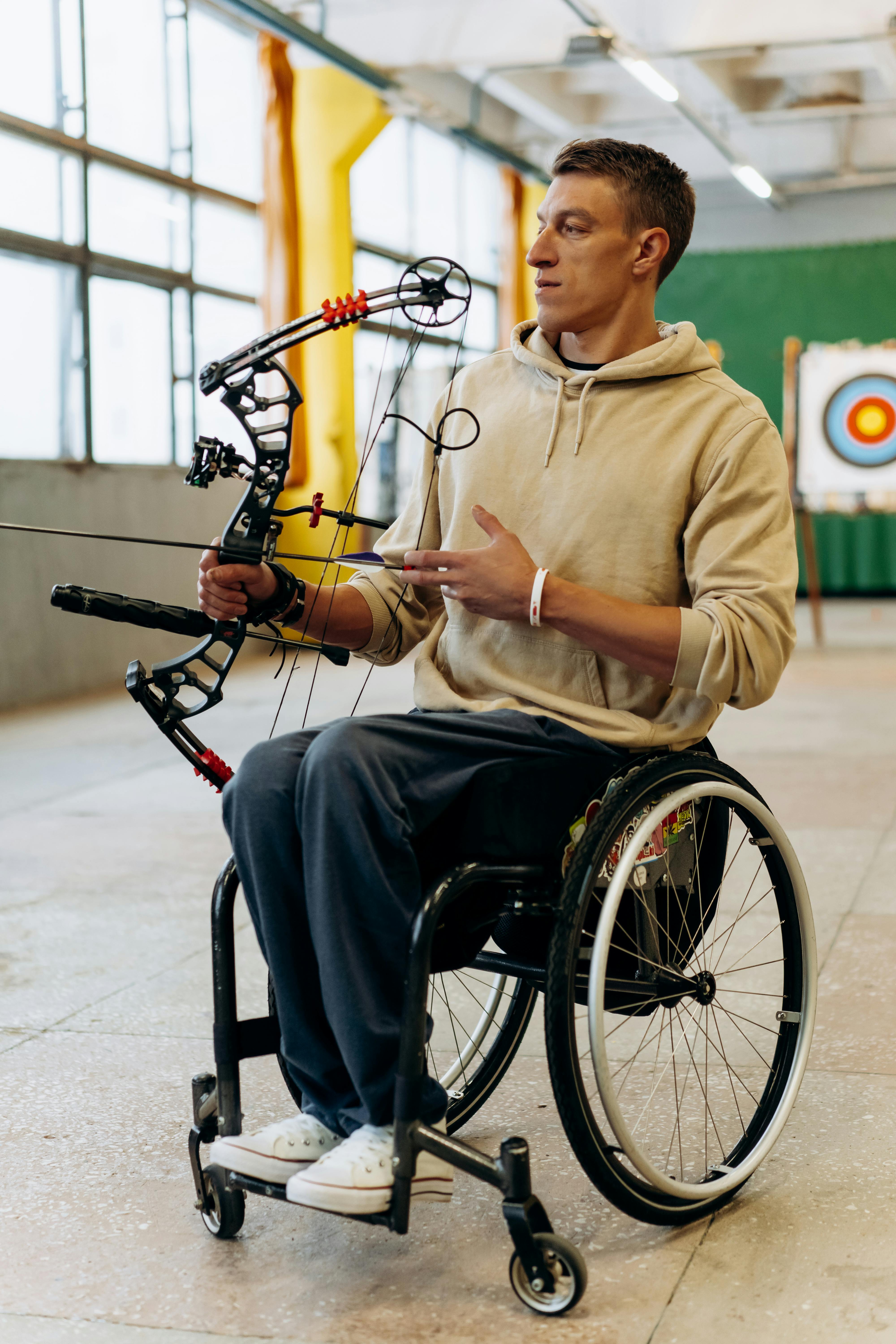 man with a bow aiming on a target
