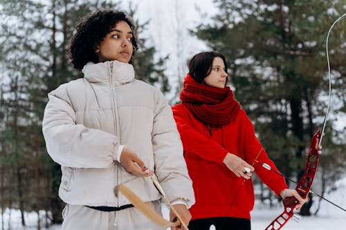 Women Holding Archery Bows