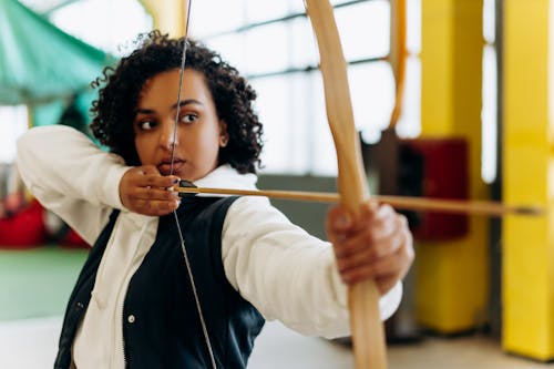 Woman Using Wooden Bow