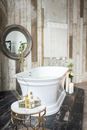 Interior of modern bathroom with spa supplies