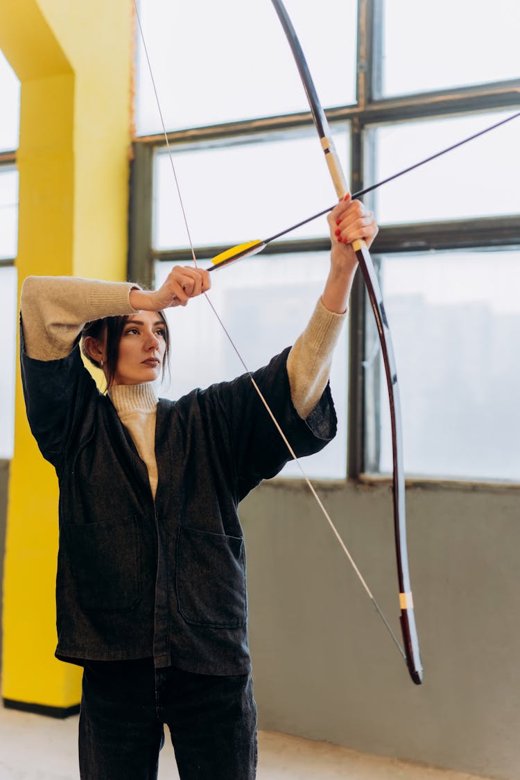 Woman Holding A Bow And Arrow