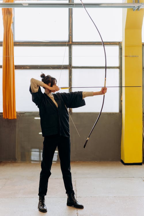 Free Person Holding a Bow Stock Photo
