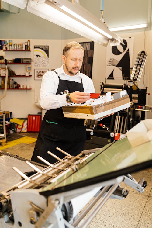 Man Working with Printing Tools