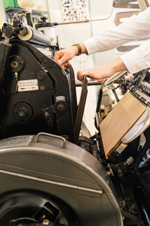 Person Working on Industrial Machine · Free Stock Photo