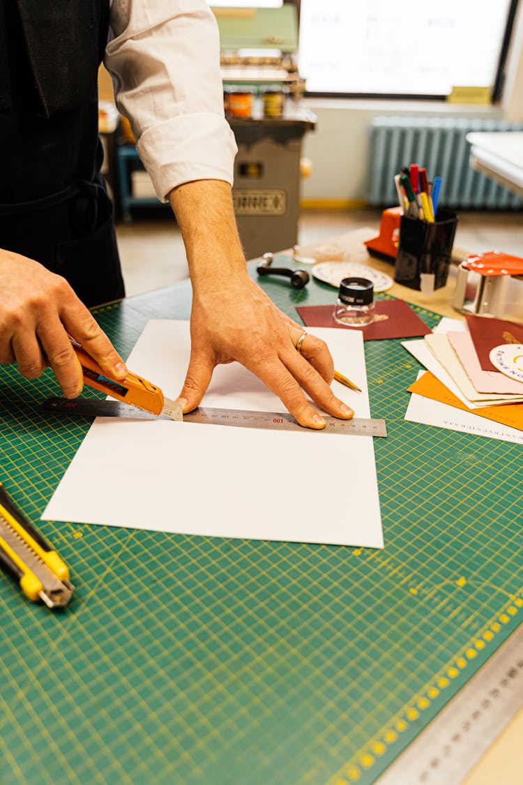 Cutting Paper On Desk