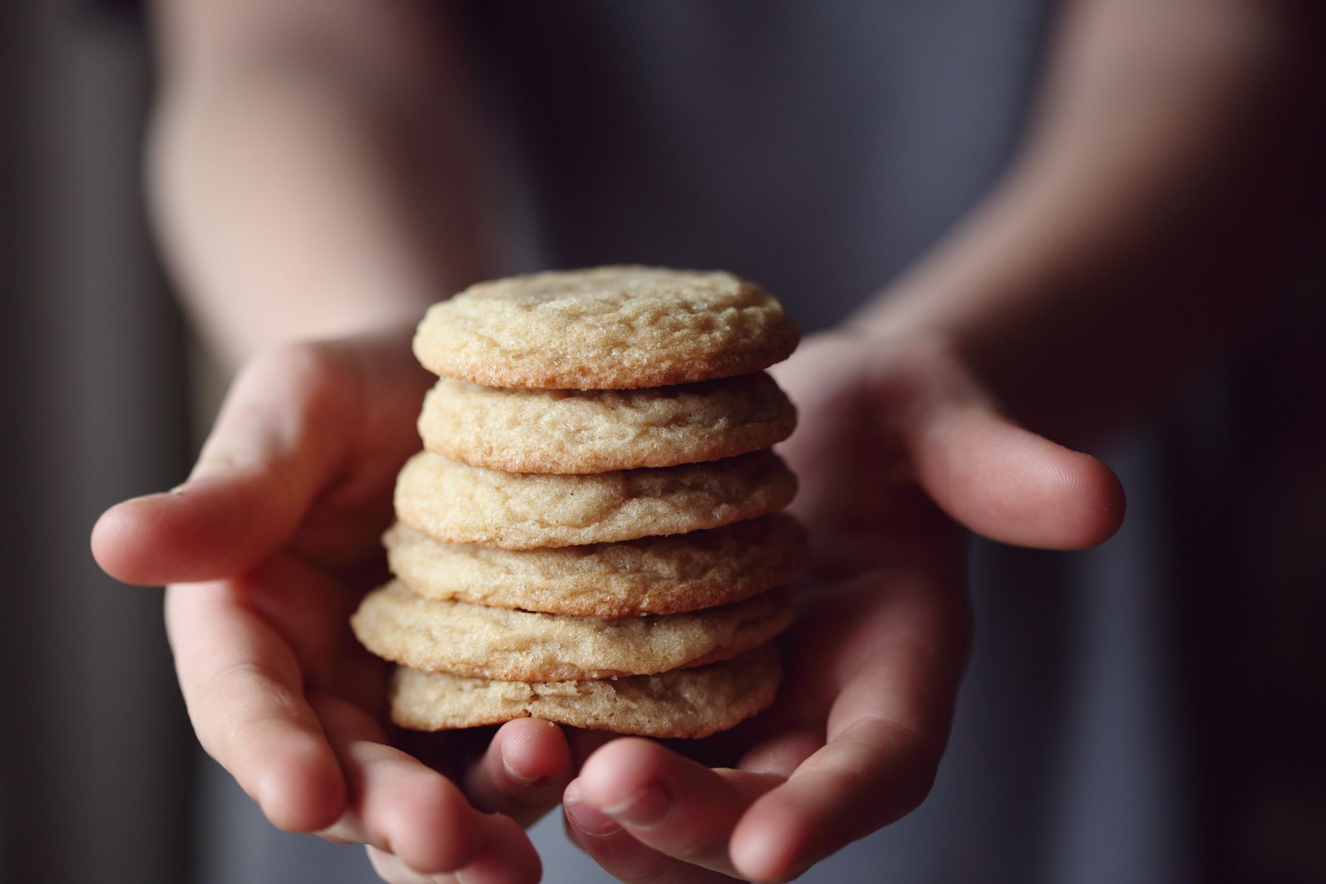 Freshly baked soft almond sugar cookies cooling on rack