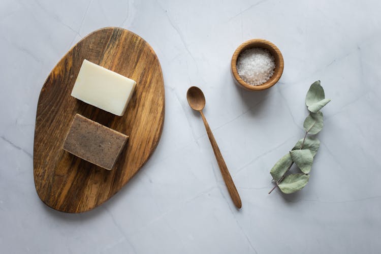 Homemade Soap On Wooden Board Near Scrub With Salt