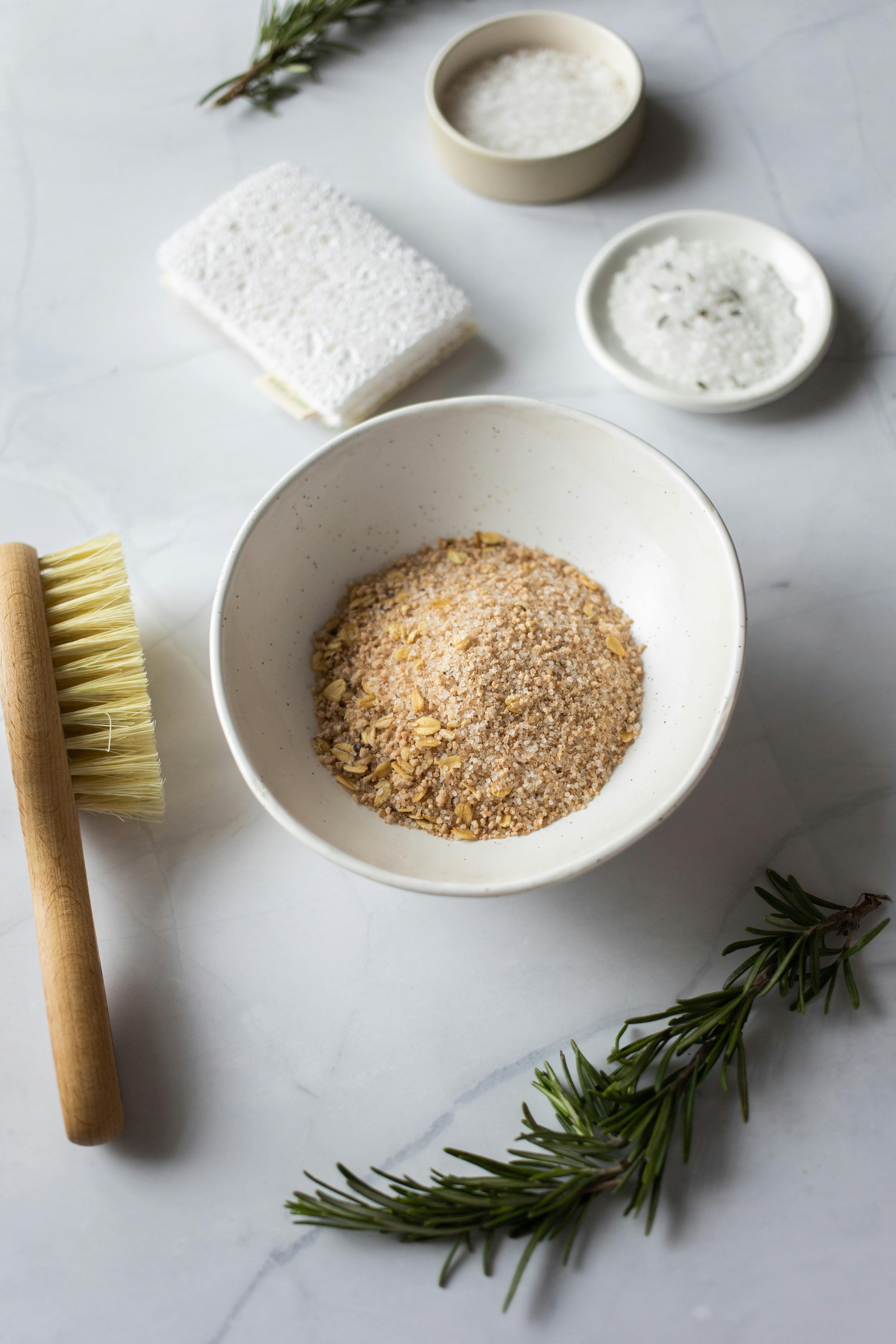 ingredients for fresh dry scrub in plates near massage brush