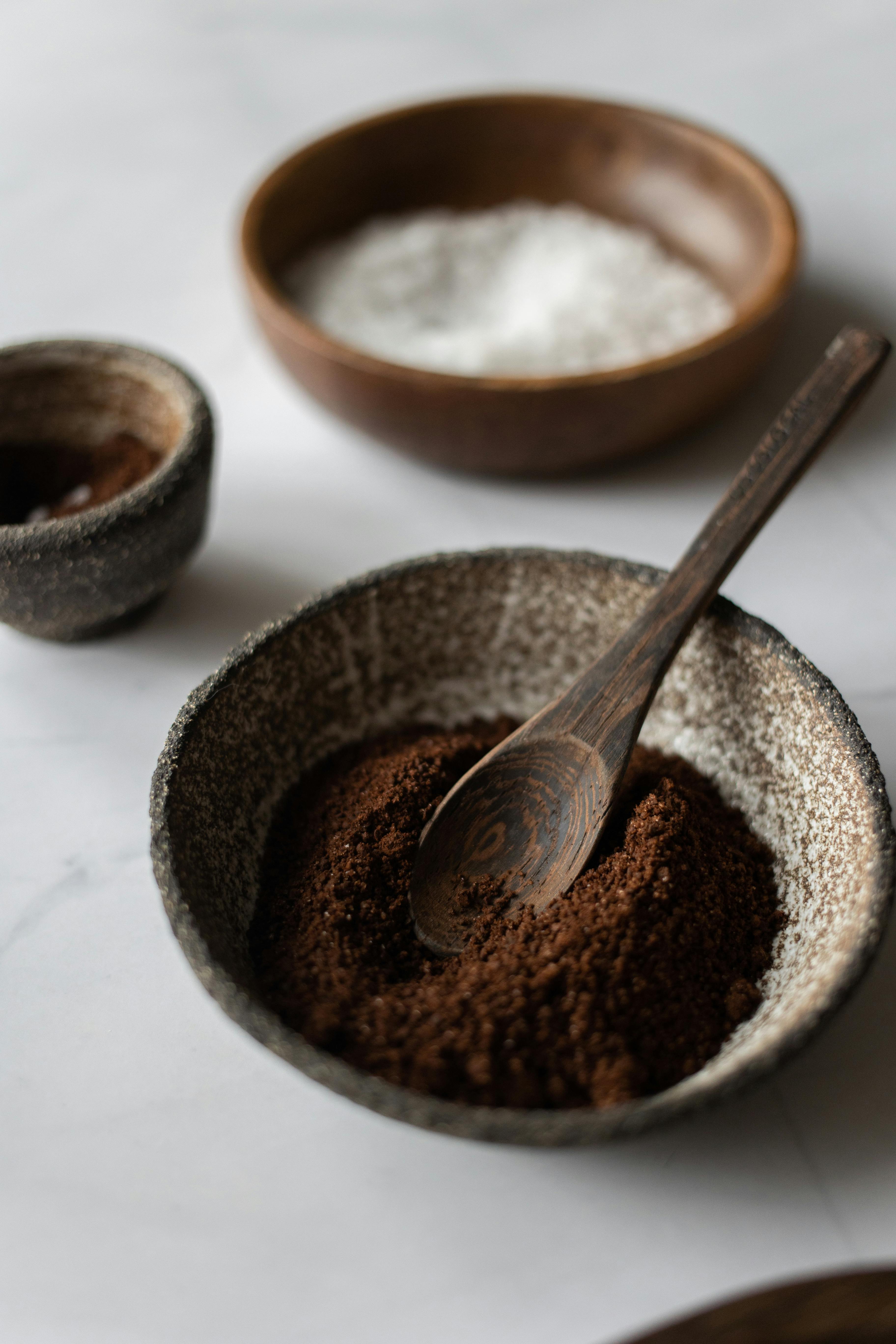 ceramic bowl with coffee and wooden spoon