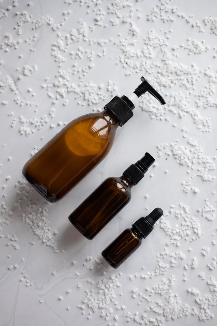 Set Of Skincare Products Placed On White Table