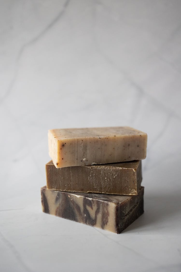 Stack Of Natural Handmade Soaps Placed On Light Surface