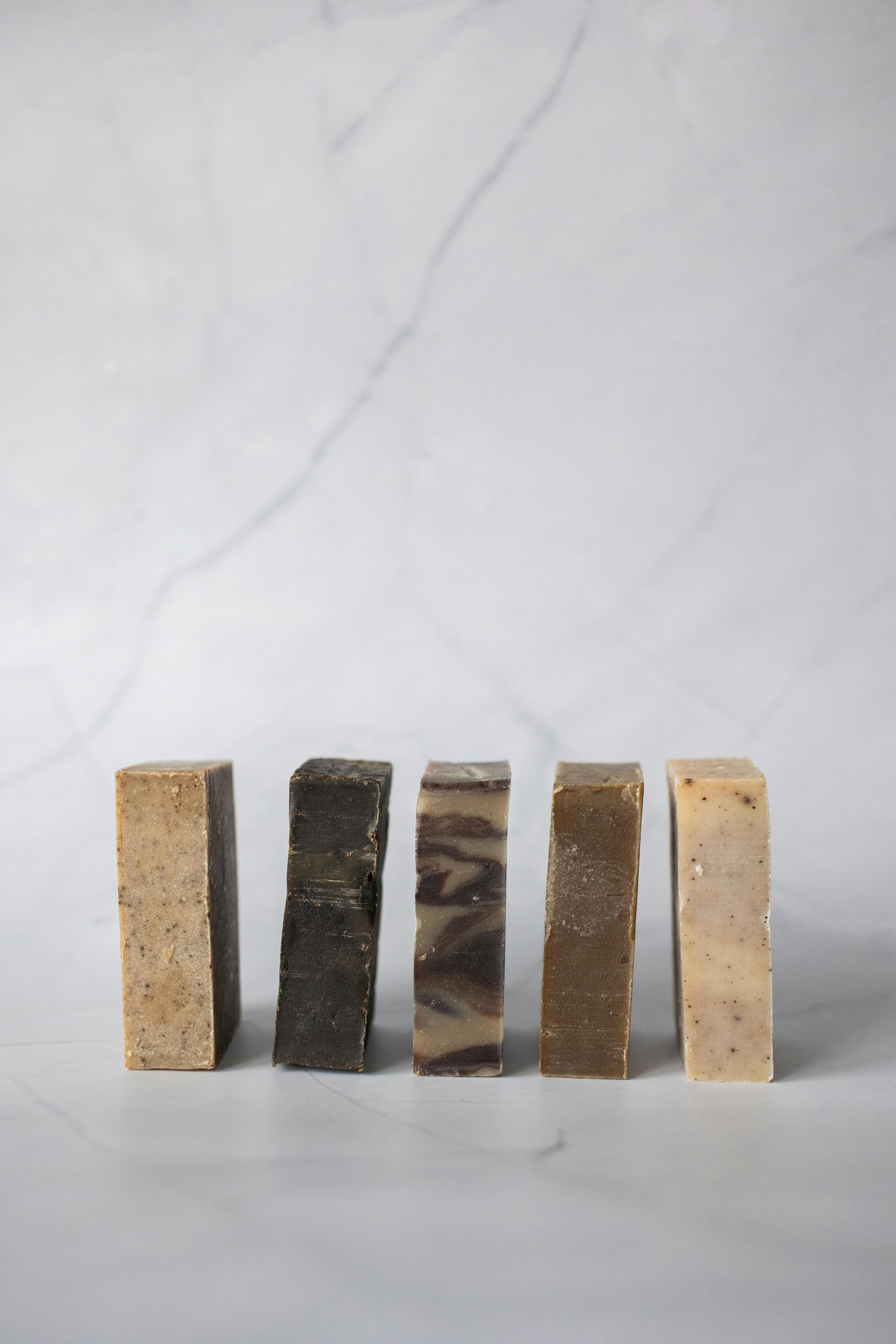 natural soaps placed in row against light background