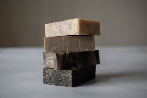 Stack of natural soaps placed on table