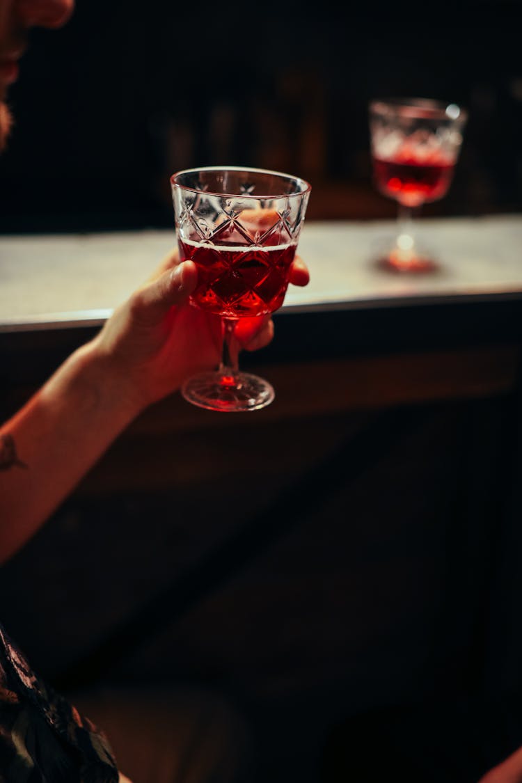 Photo Of Person Holding A Wine Glass