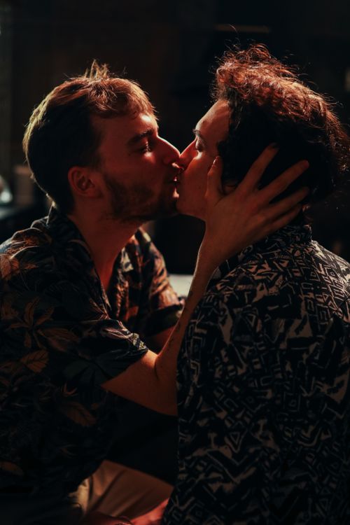 Free A tender kiss shared between two people symbolizes love and connection. Stock Photo