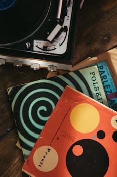 Overhead view of vintage vinyl records and a turntable, capturing a retro aesthetic.