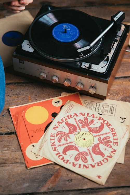 Person Playing Music With A Vinyl Record