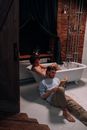 Man in White Ceramic Bathtub
