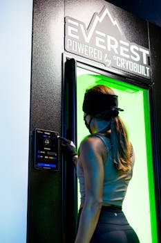 A woman engaging in cryotherapy at an Everest chamber, enhancing wellness indoors.