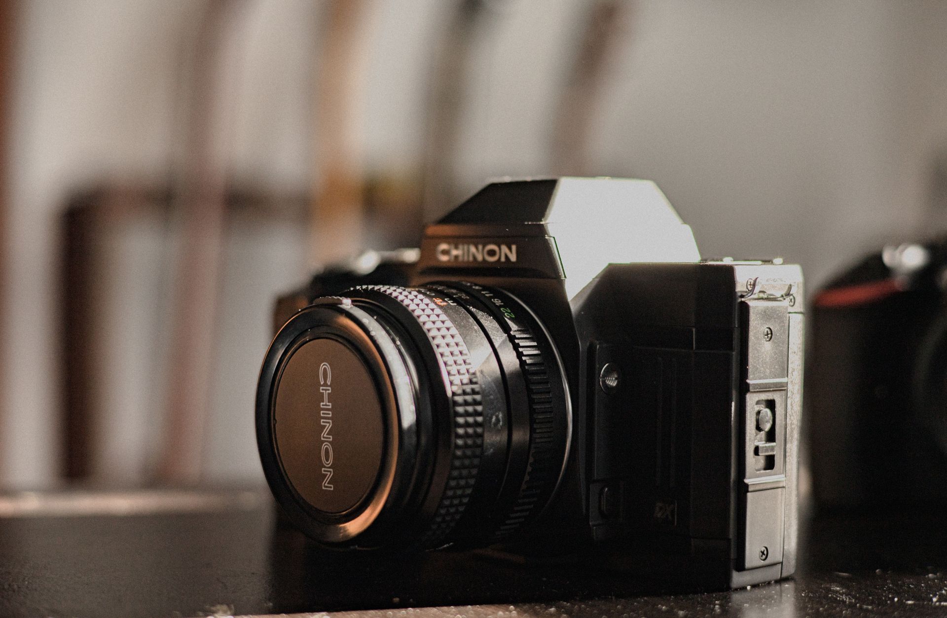 Close-up image of a Chinon film camera, perfect for photography enthusiasts.
