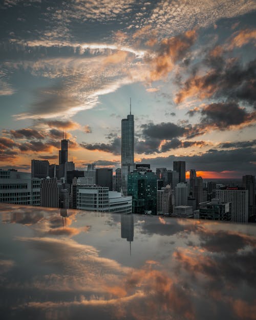 Top View of City Skyline During Sunset Reflecting on Glass