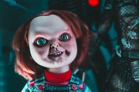 Doll with blue eyes and freckles on terrible face