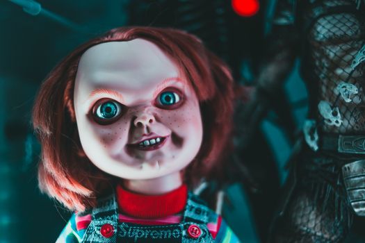 Doll with blue eyes and freckles on terrible face