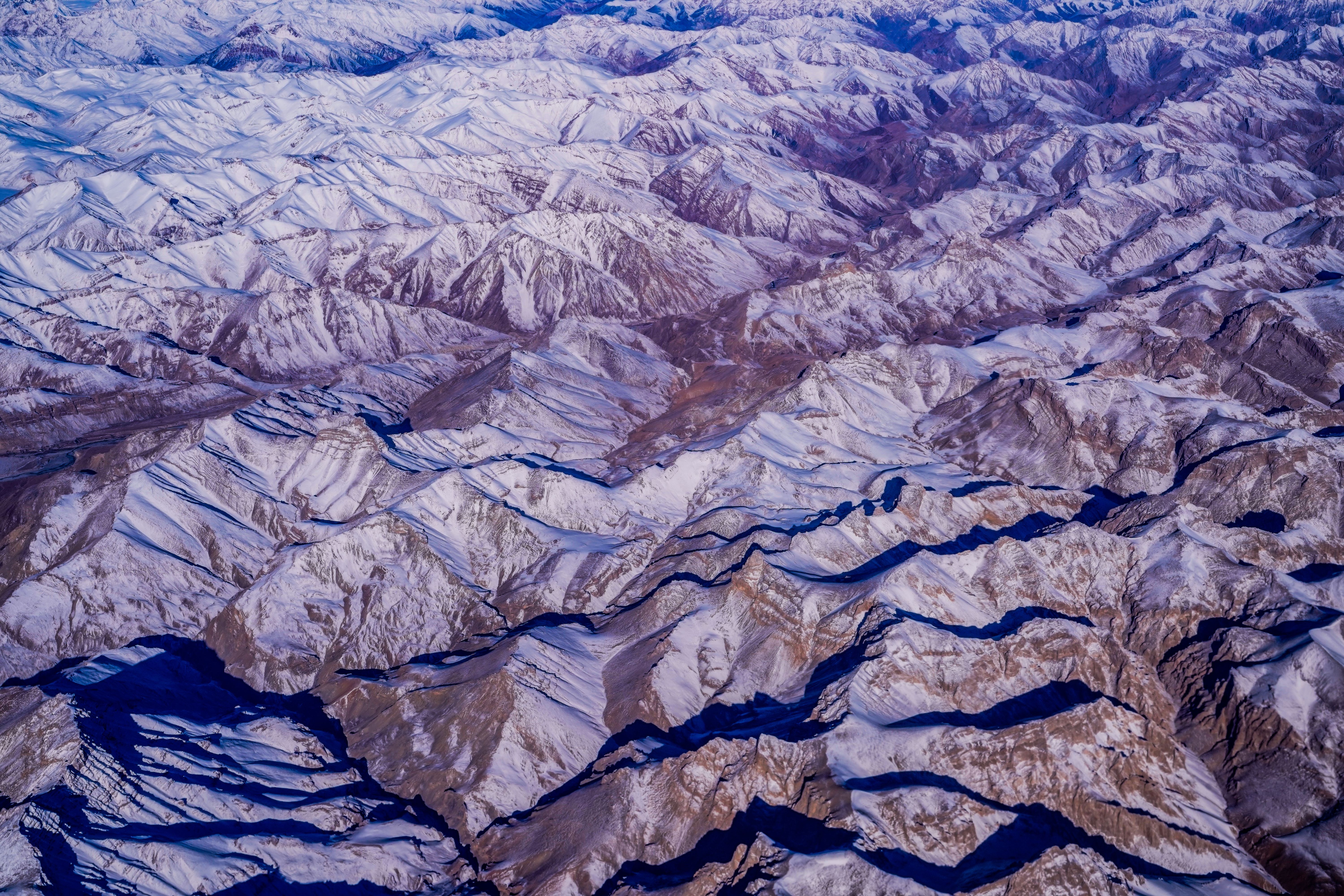 Drone Shot of Snow-Covered Mountains · Free Stock Photo