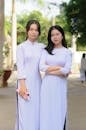 Women in White Long Sleeve Dress Standing