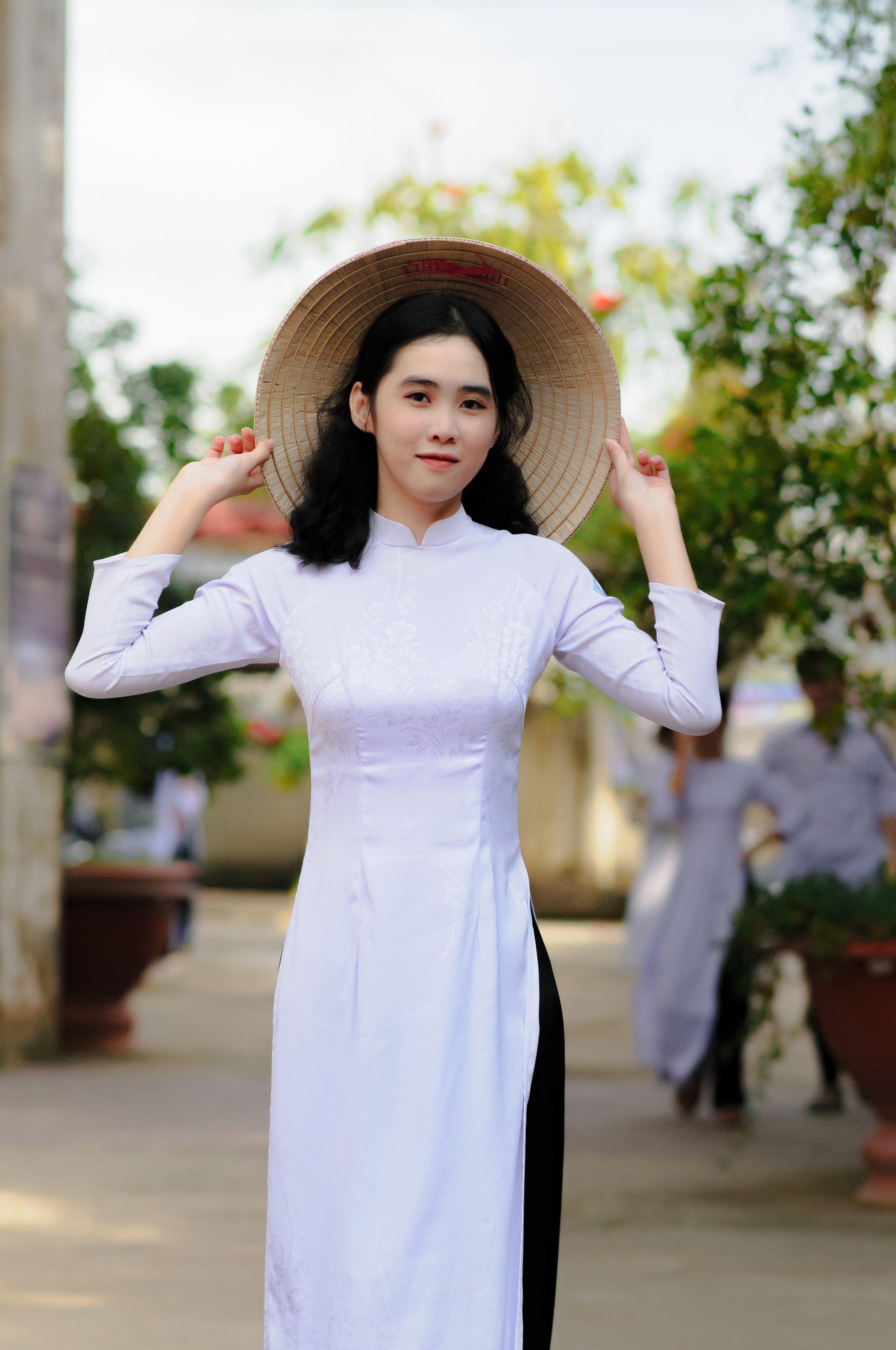 Woman in White Long Sleeve Dress Wearing Brown Hat · Free Stock Photo