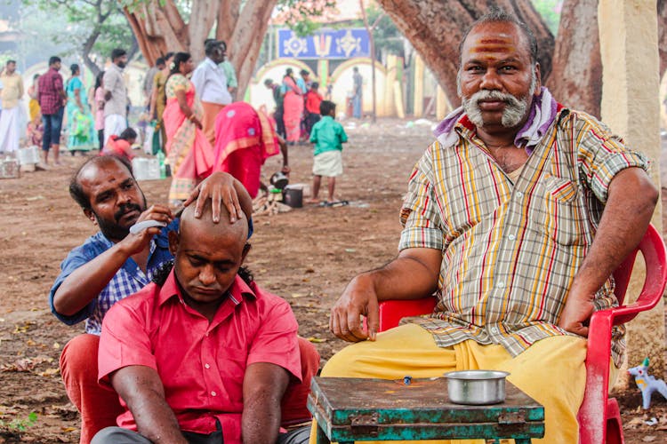 Man Sleeping While Someone Is Shaving His Head 