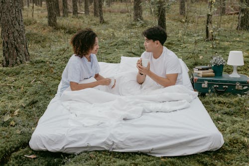 Romantic Couple Having a Picnic in the Forest 