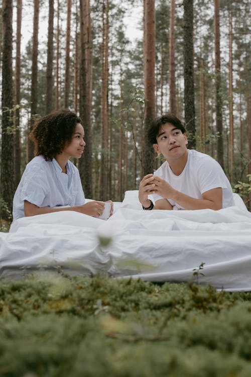 Romantic Couple Having a Picnic Date in the Forest
