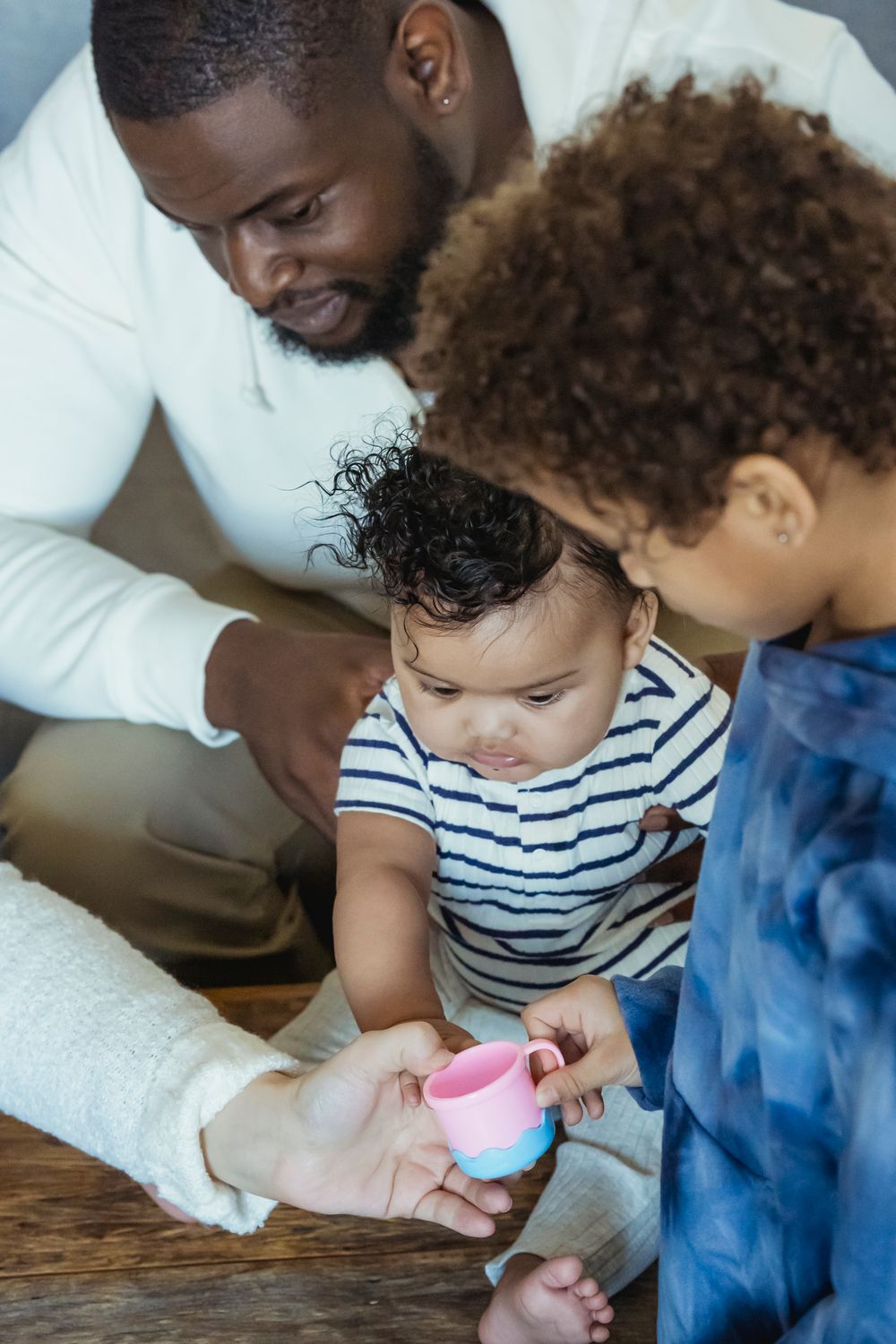 Black father spending time with his children at home