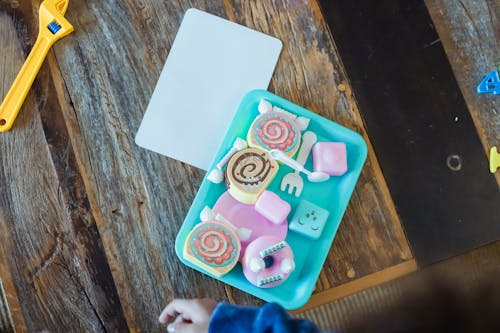 Bright toys of cookies composed with spoons and forks