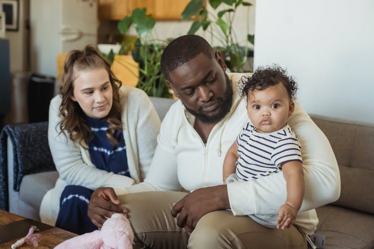 Multiethnic Mother And Father With Cute Baby