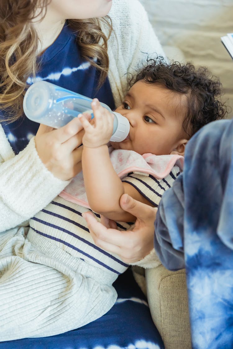 Crop Mother Feeding Black Baby