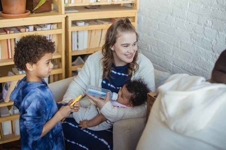 Cheerful Diverse Family With Children At Home