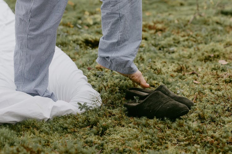 A Person Wearing Black Shoes