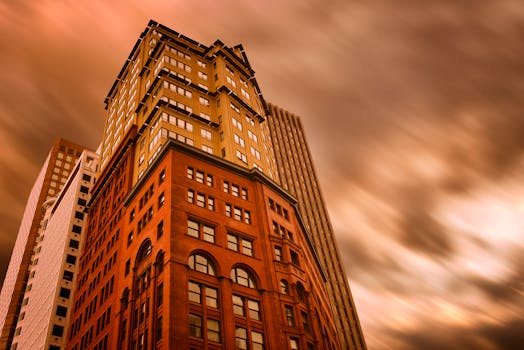 Dramatic view of San Francisco skyscrapers against a vivid sunset sky.