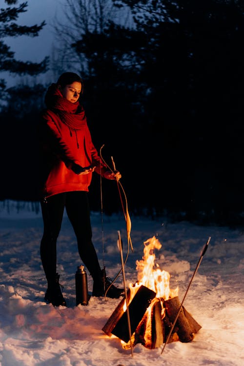 Free Photo of an Archer Standing Near a Campfire Stock Photo
