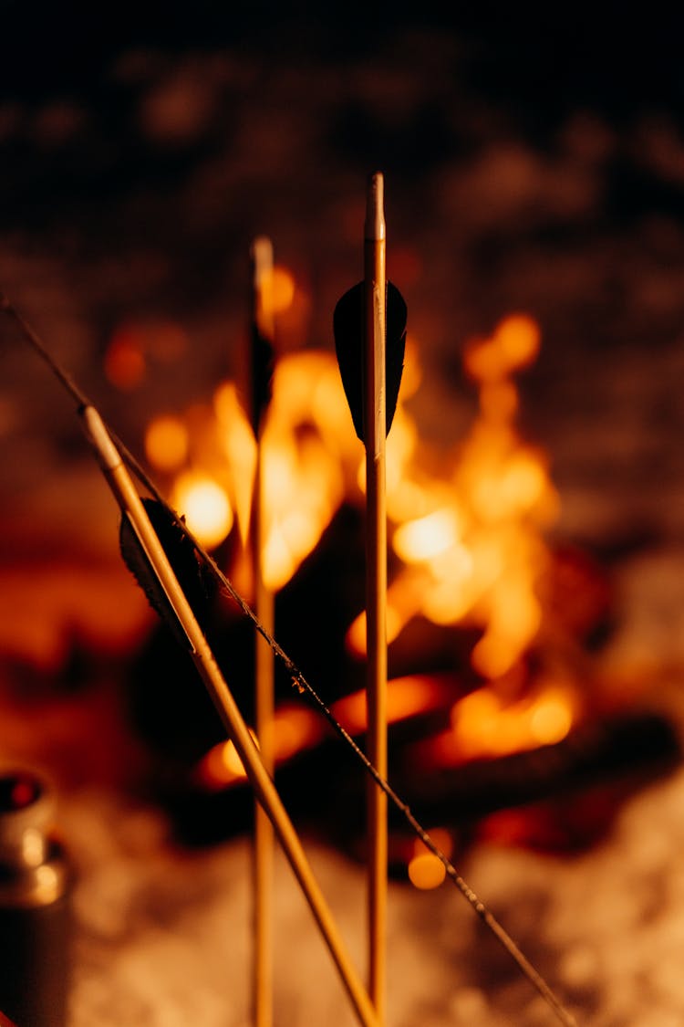 Wooden Arrows Beside A Bonfire