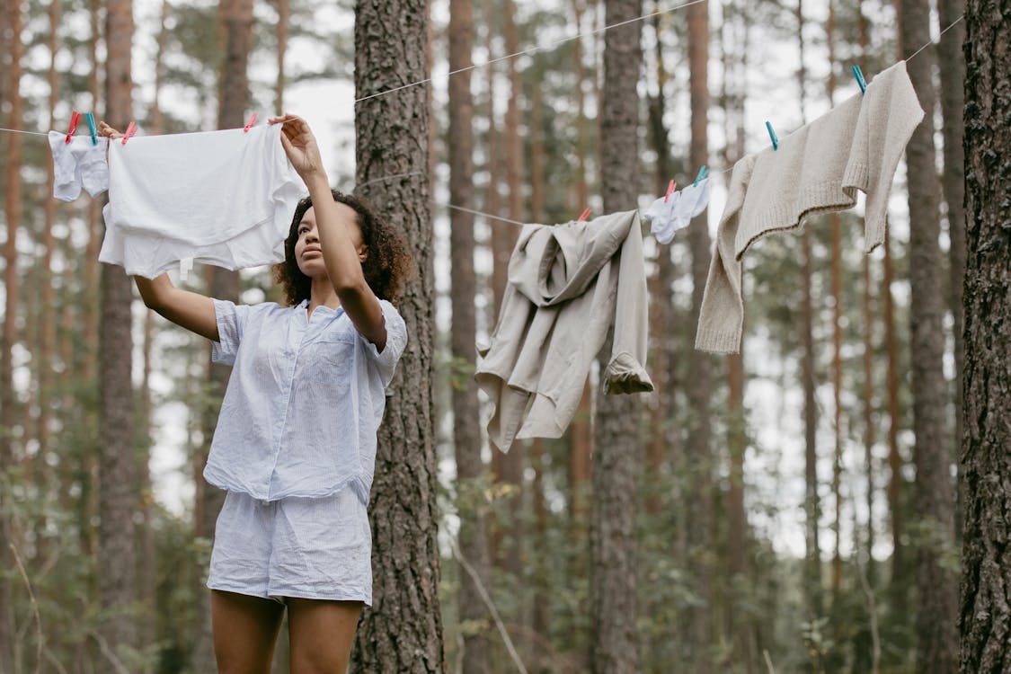 Woman Hanging her Clothes · Free Stock Photo