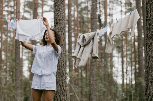 Free Woman Hanging her Clothes Stock Photo