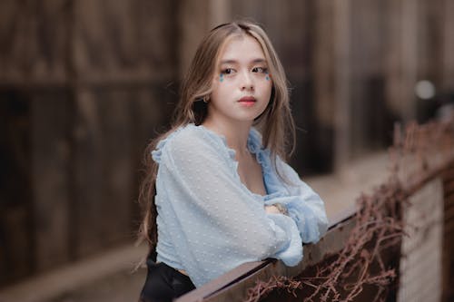 Woman in Blue Long Sleeve Top