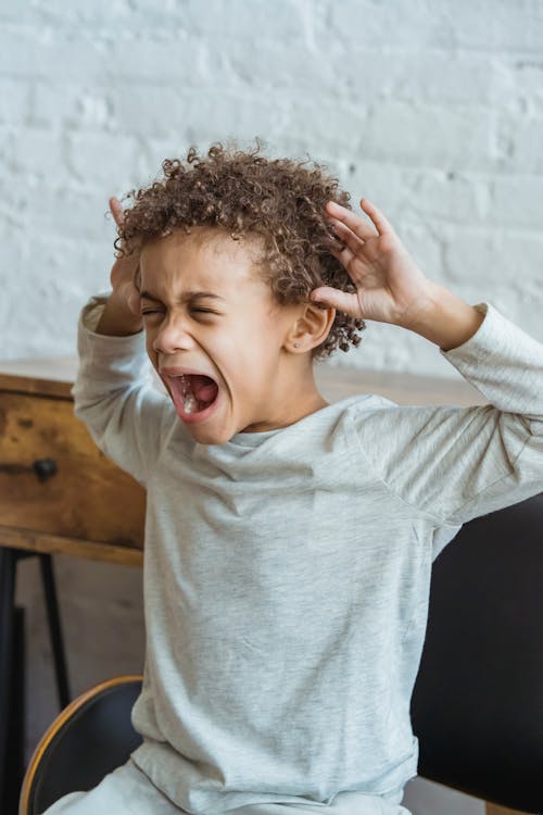 Free Desperate Screaming Young Boy Stock Photo