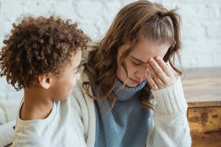 Black Boy Comforting Upset Mother