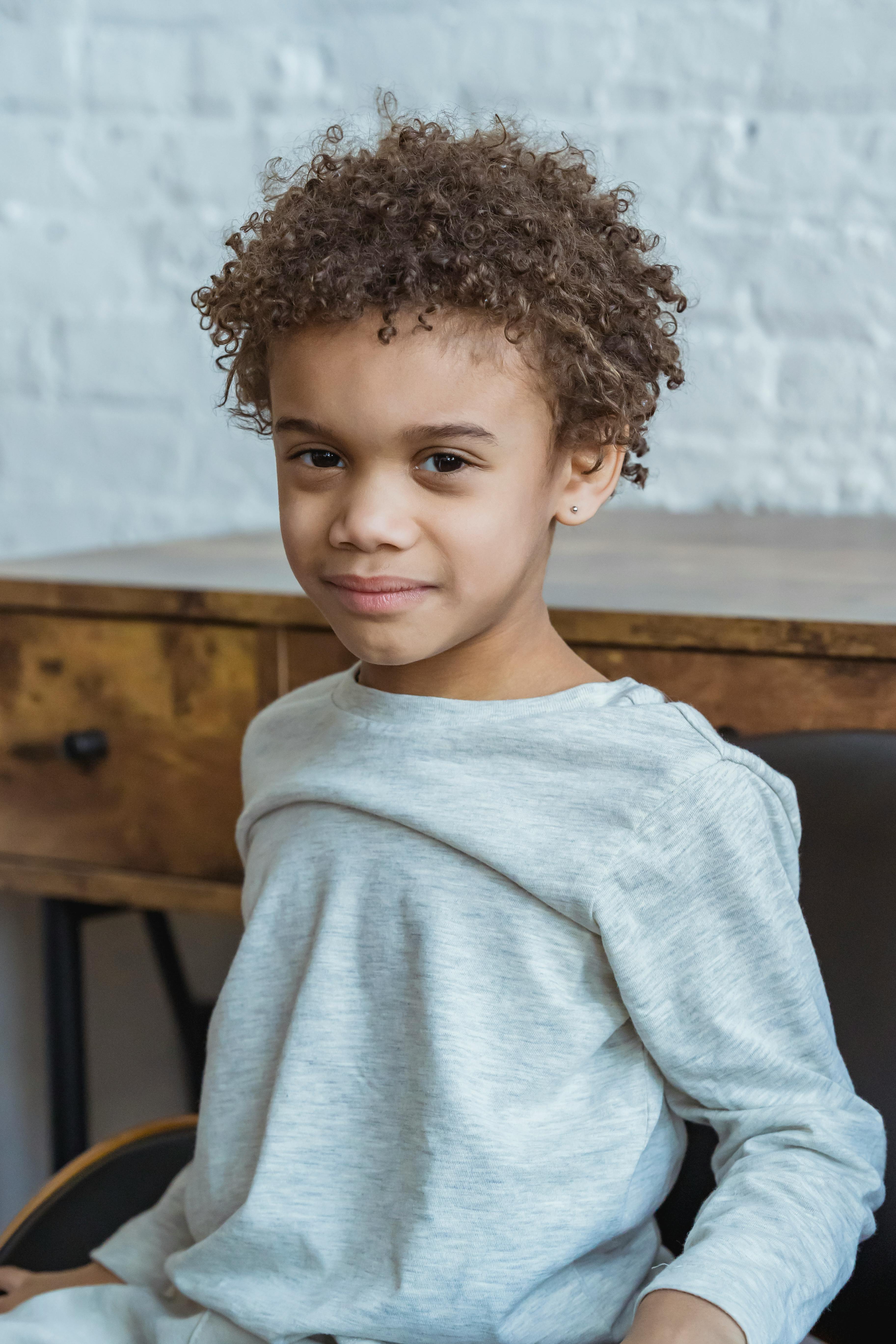 positive black boy in room